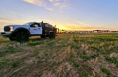 Warne Green Force truck spraying a pasture