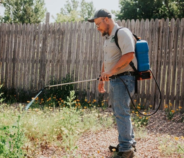 Warne Green Force worker spraying bare ground to prevent weeds